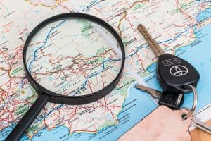 A map with keys and a magnifying glass, used to unlock the power of Google local business listing for success.